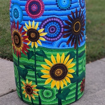 Rain barrel with sunflowers